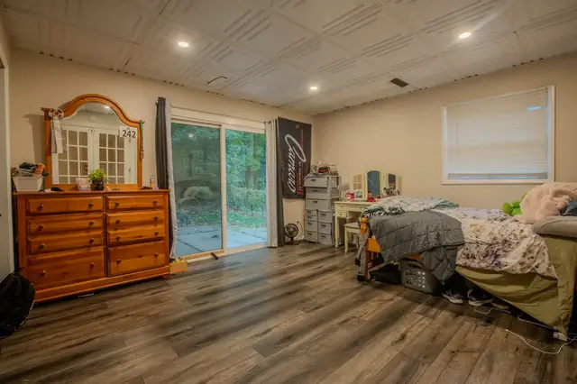 Bedroom three, patio door, 1522 Burcham Dr, East Lansing student rental